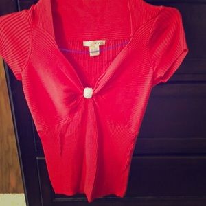 Red Ribbed blouse with diamond brooch accent